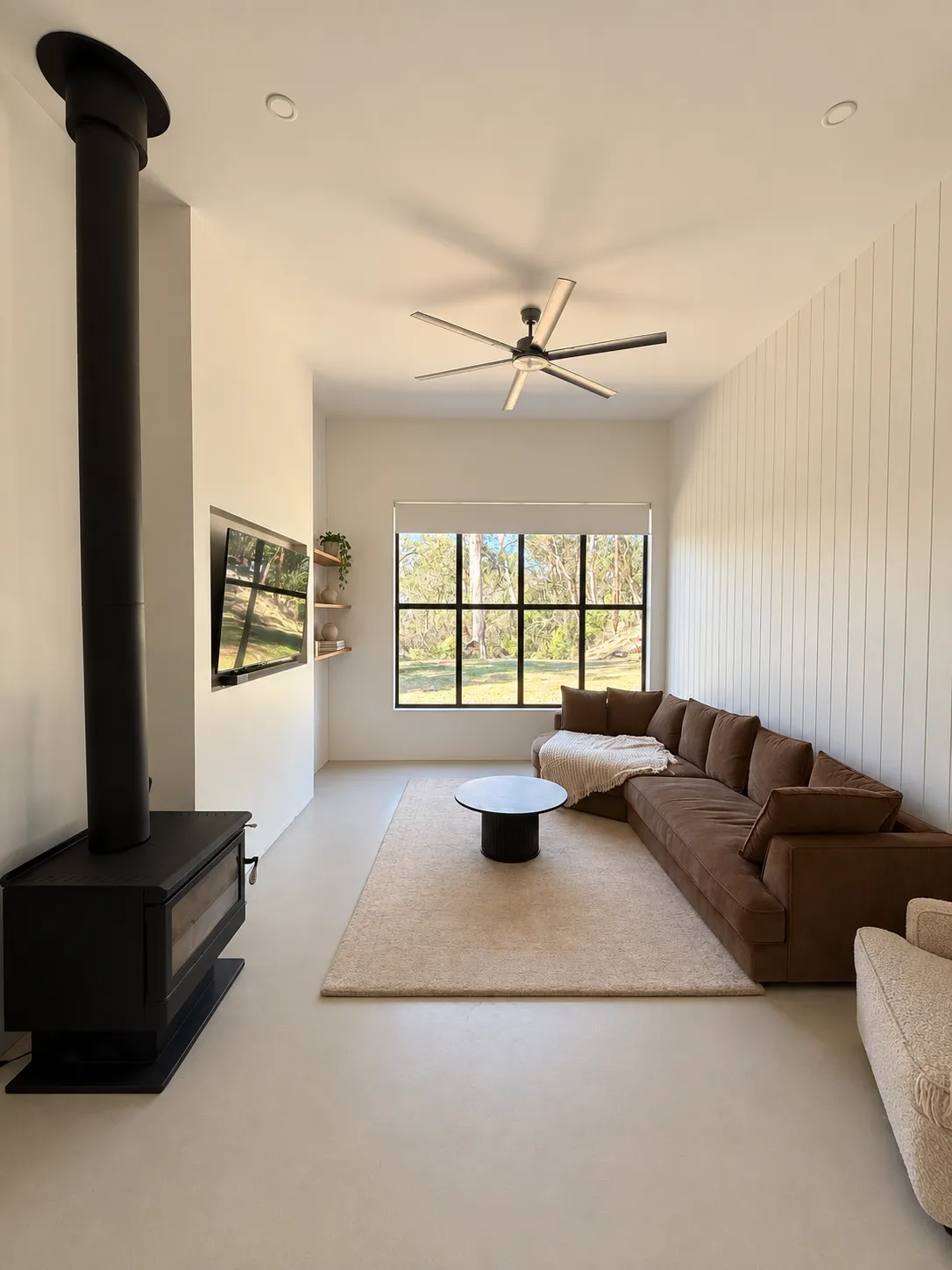 Garden guest house lounge with fireplace and garden window