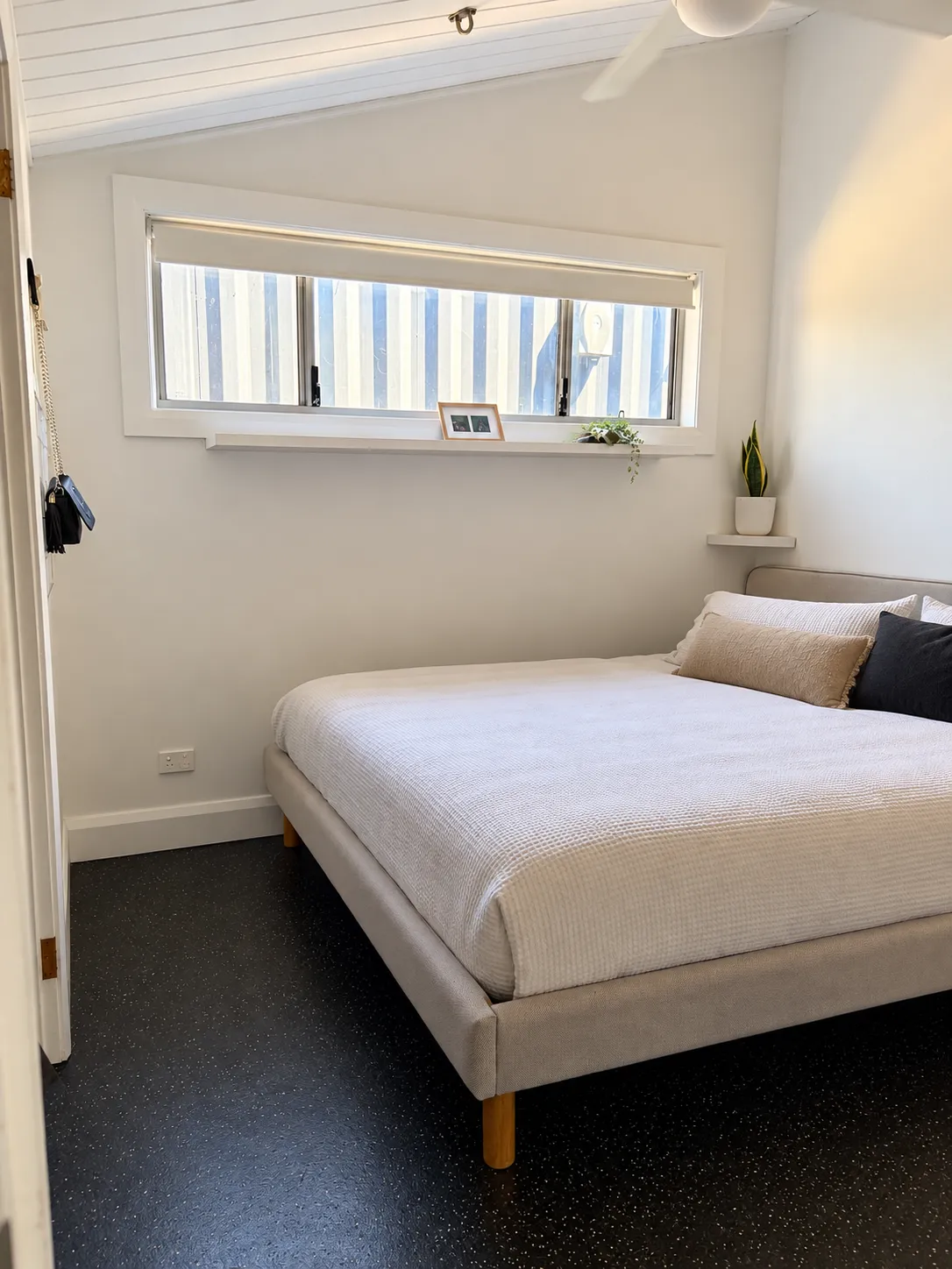 Other guest house bedroom with high window