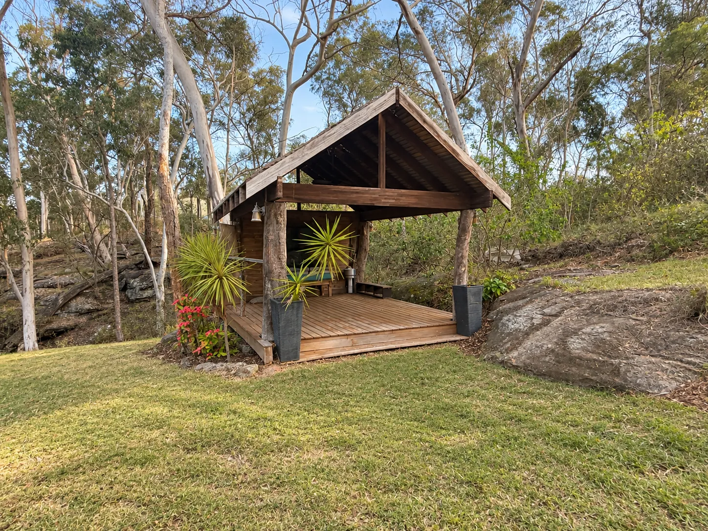Timber gazebo and deck at the edge of the bush