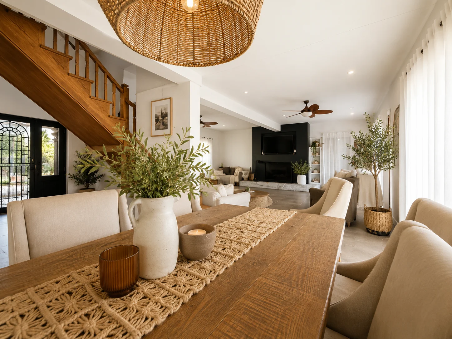 Main home dining and living room with timber staircase