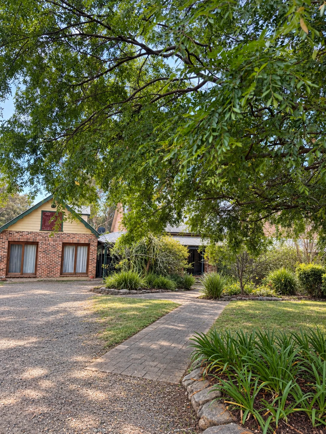 Main residence seen from the driveway and gardens